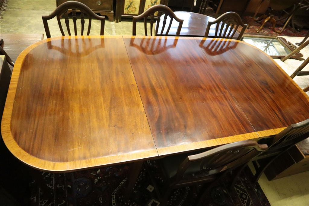 A Georgian style satinwood-banded mahogany D-end dining table with additional leaf, 195cm extended and a set of eight Hepplewhite style